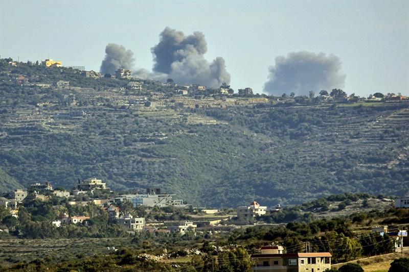 Smoke rising after an Israeli strike between the villages of Qaouzah and Ramia near the border with 