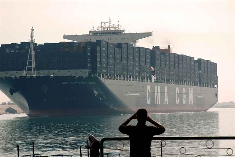 The largest and newest container ship in the world, the CMA CGM Marco Polo, sails through the Suez C
