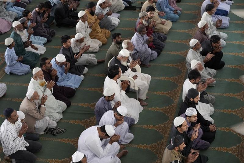 People perform the Friday Prayer at a mosque in Karachi, Pakistan
