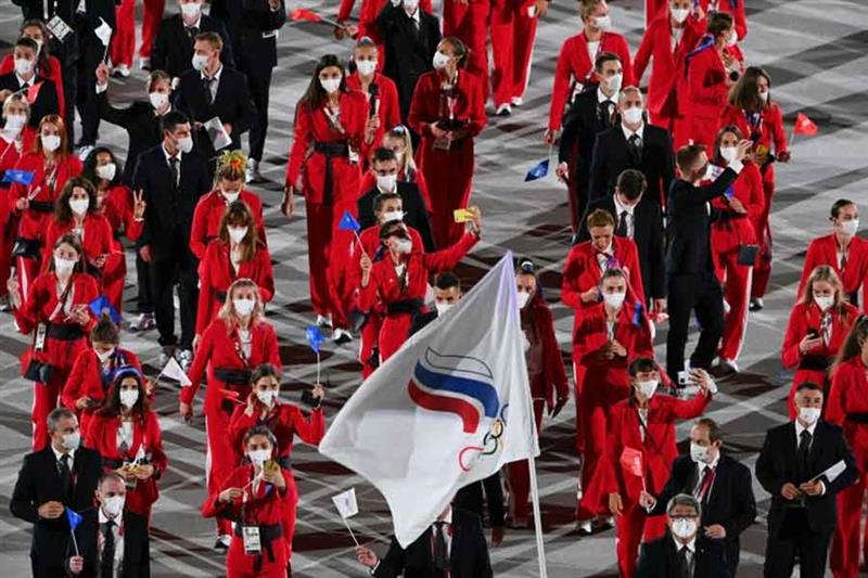Athletes parade behind the Russian Olympic Committee flag at the opening ceremony of the Tokyo Olymp