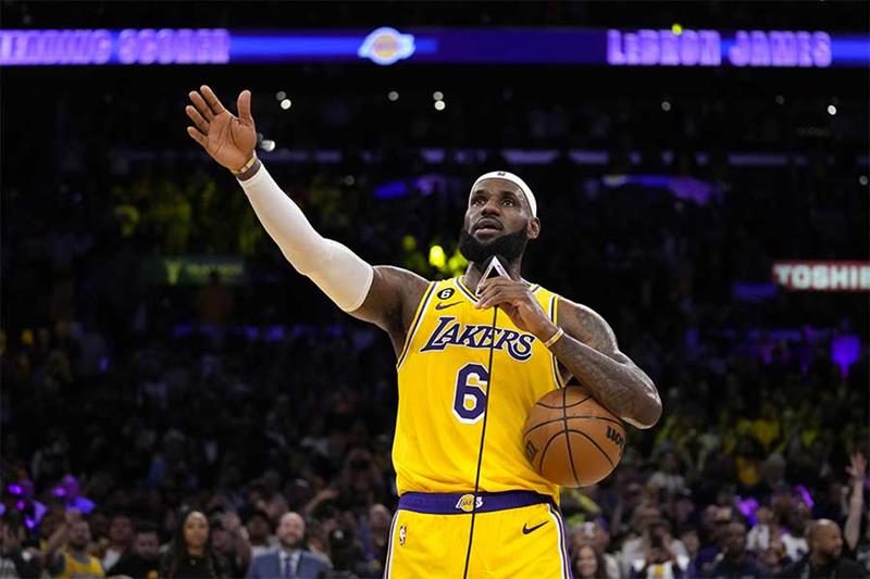 Los Angeles Lakers forward LeBron James speaks to fans after passing Kareem Abdul-Jabbar to become t