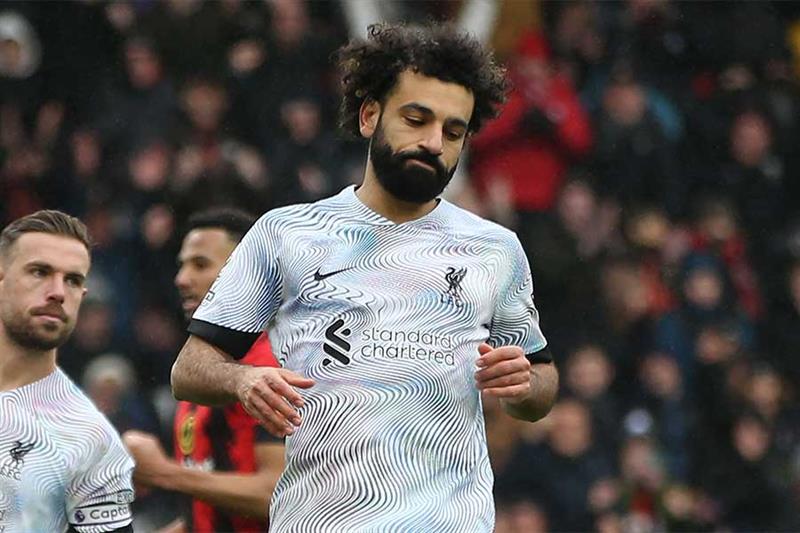 Liverpool s Egyptian striker Mohamed Salah reacts after missing his penalty kick during the English 
