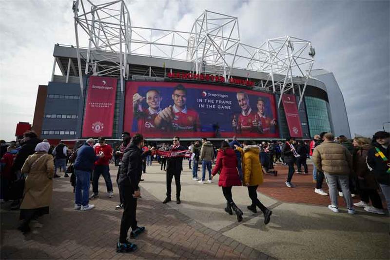 Fans outside the Old Trafford stadium in Manchester ahead the English Premier League soccer match be