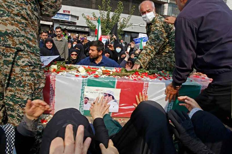 Iranians rally in Tehran to denounce a mass shooting at a key shrine that killed more than a dozen w