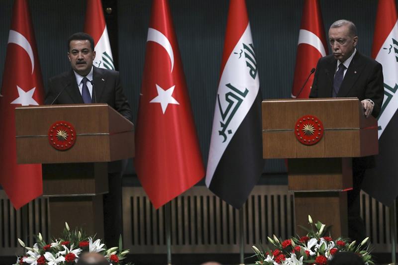 Turkey s President Recep Tayyip Erdogan, right, and Iraq s Prime Minister Mohammed Shia al-Sudani 