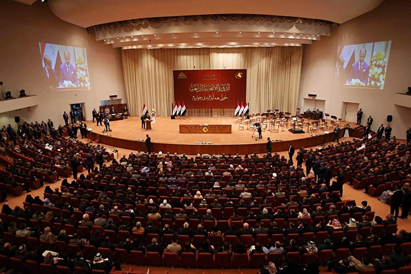 Iraqi lawmakers attend a parliament session in Baghdad, Iraq
