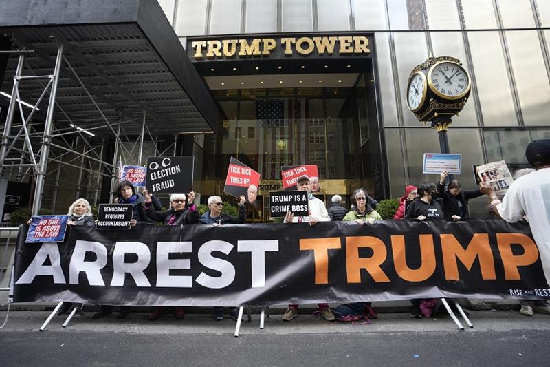 Protesters gather outside Trump Tower on Friday, March 31, 2023, in New York. 