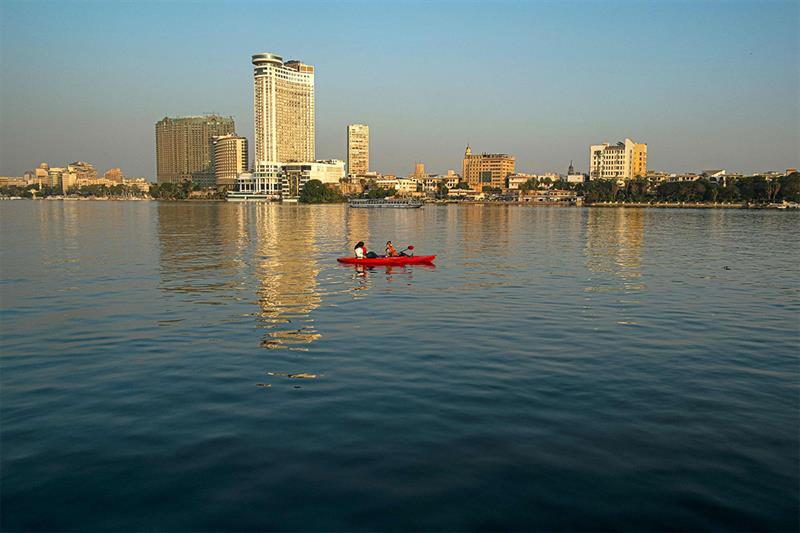 File Photo: Two women row a skiff in the Nile river in the Egyptian capital Cairo. AFP