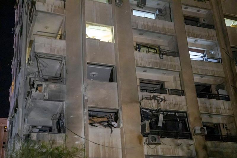 Damage caused to a building following a reported Israeli missile strike aimed at Iranian and Hezboll