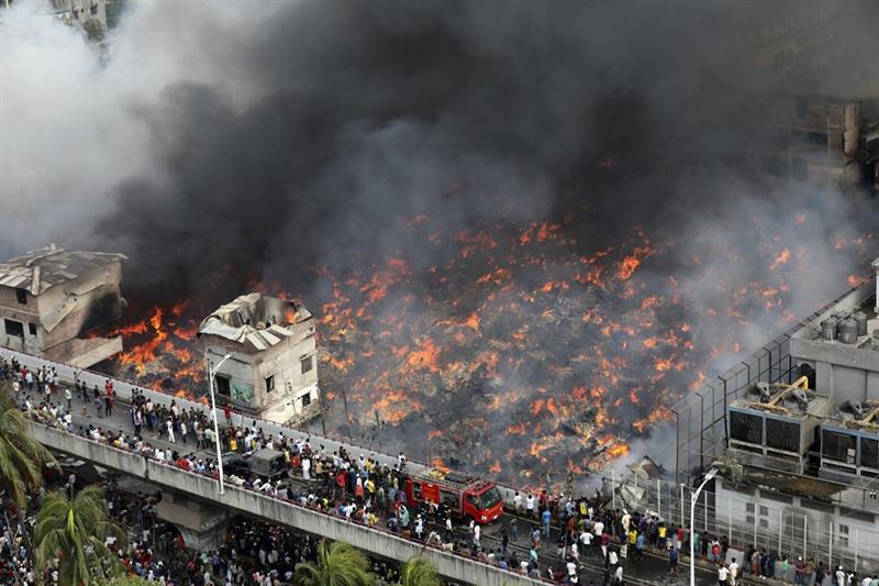 A fire rages at a popular market for cheaper clothes in Bangladesh s capital Dhaka, Bangladesh