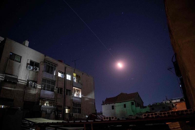 Flares of syrian air defense rockets are seen in the sky of Damascus on April 4, 2023. 