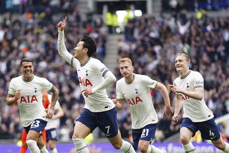 Tottenham Hotspur s Son Heung-min, second left, celebrates scoring their side s first goal of the ga