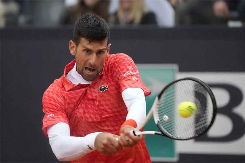 Serbia s Novak Djokovic returns a ball to Denmark s Holger Rune during their match at the Italian Op