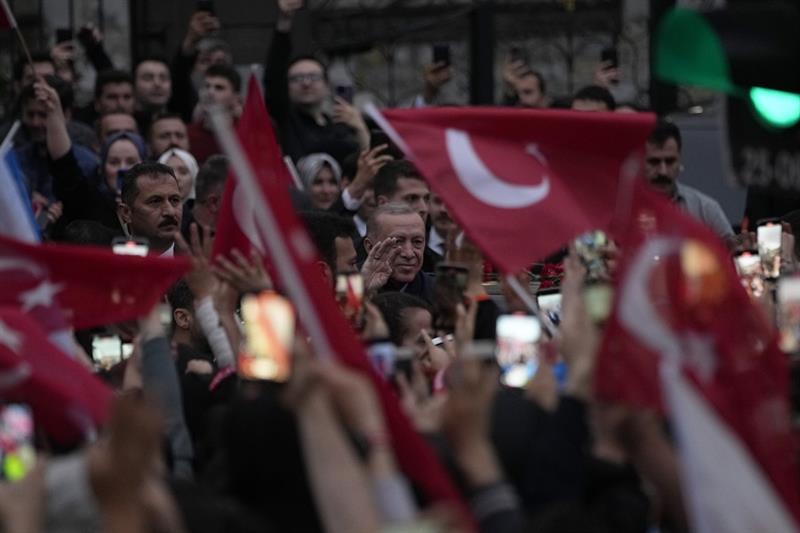 President Recep Tayyip Erdogan waves to supporters