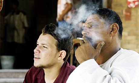 A file photo of an Egyptian man smoking a cigarette AP