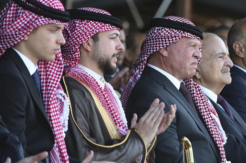 Jordan s Crown Prince Hussein, second left, sits with his father, King Abdullah II, third left
