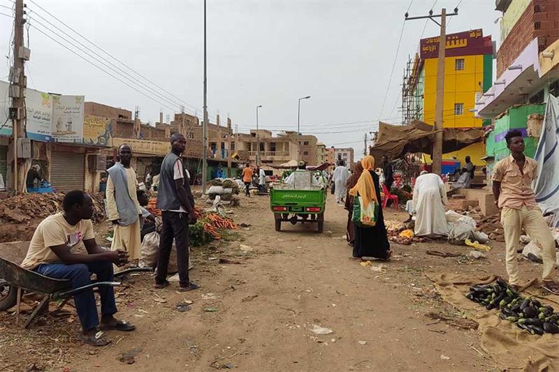 People gather at a market to buy food provisions, in Khartoum on June 10, 2023. AFP
