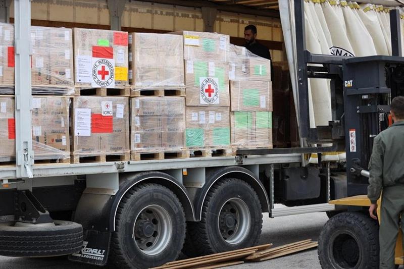 A forklift loading humanitarian aid to Sudan