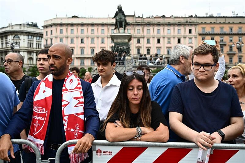 People wait outside the Duomo cathedral in Milan on June 14, 2023 ahead of the state funeral for Ita