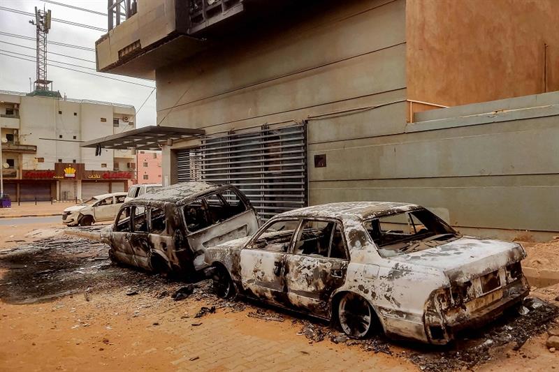 Destroyed vehicles are pictured outside the burnt-down headquarters of Sudan s Central Bureau of Sta