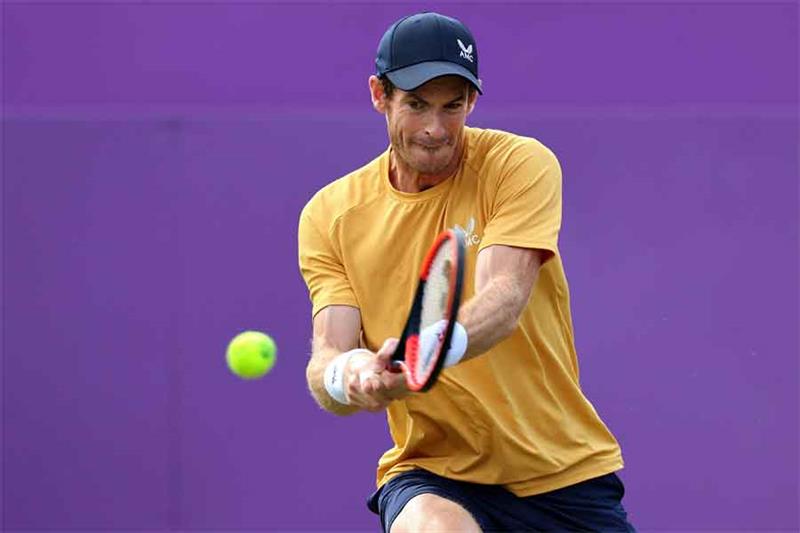 Britain s Andy Murray returns against Australia s Alex de Minaur during their men s singles round of