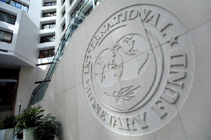 The International Monetary Fund logo is seen inside its headquarters at the end of the IMF/World Ban
