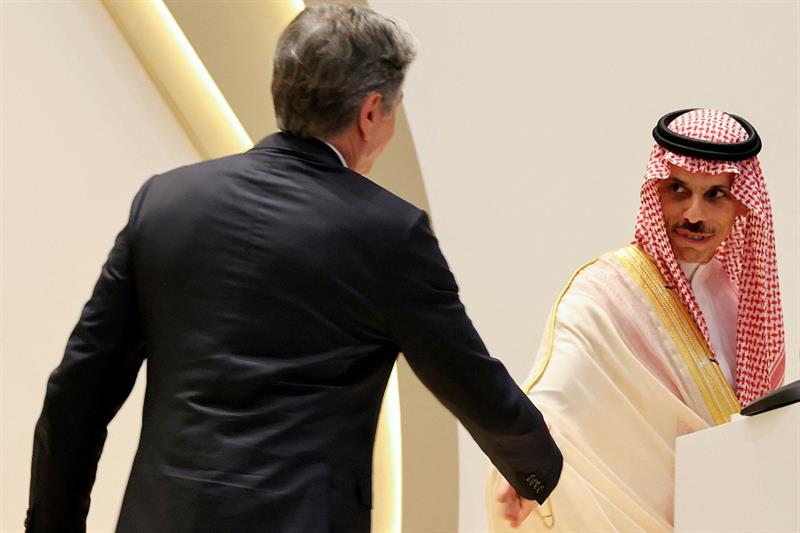 US Secretary of State Antony Blinken (L) approaches to shake the hands of Saudi Foreign Minister Fai