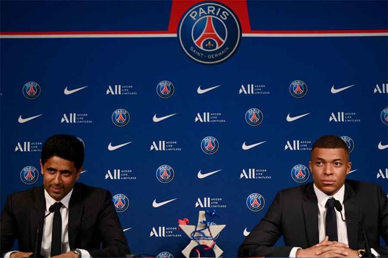 Paris Saint-Germain s CEO Nasser Al-Khelaifi (L) and French forward Kylian Mbappe (R). AFP