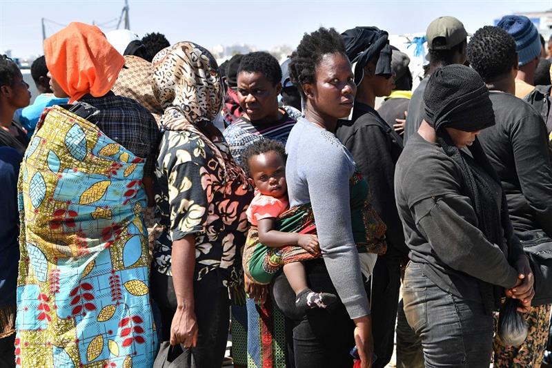 Migrants of African origin trying to flee to Europe, disembark in Sfax from a ship owned by the Tuni