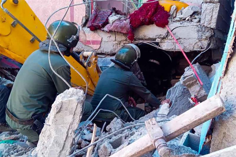 Rescue workers search for survivors in a collapsed house in Moulay Brahim, Al Haouz province, on Sep