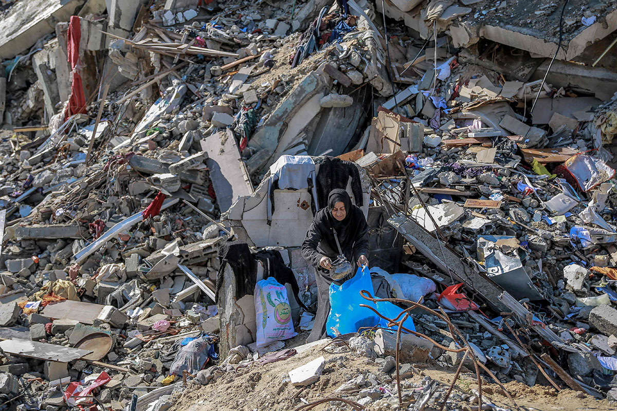 PHOTO GALLERY:  Palestinians look for survivors in the rubble in the southern Gaza after Israeli bombardment.