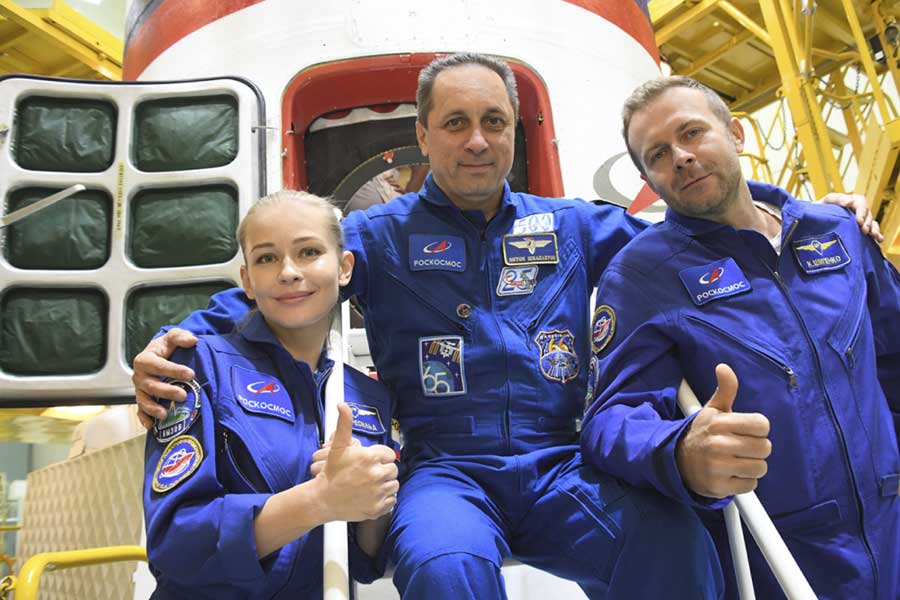 In this handout photo released by Roscosmos, Actress Yulia Peresild, left, director Klim Shipenko' right, and cosmonaut Anton Shkaplerov, members of the prime crew of Soyuz MS-19 spaceship pose at the Russian launch facility in the Baikonur Cosmodrome, Kazakhstan, Wednesday, Sept. 29, 2021. AP 