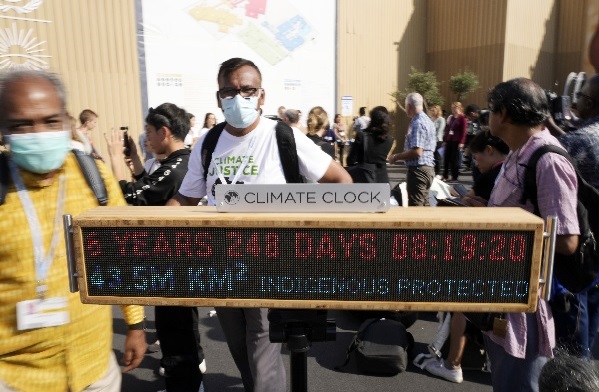 A climate clock displays how much time is left before the world uses up the carbon emissions that can still be produced while staying at or below the 1.5 degrees warming goal at a demonstration during the COP27 U.N. Climate Summit, Wednesday, Nov. 16, 2022, in Sharm el-Sheikh, Egypt
