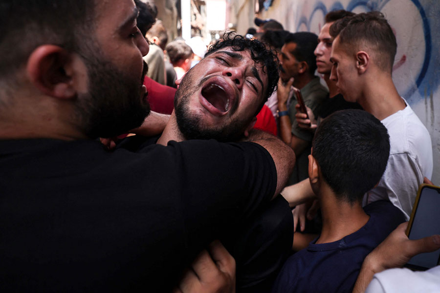 The friend of a young Palestinian killed in Jabalia refugee camp in Gaza reacts during his funeral (photo: AFP)
